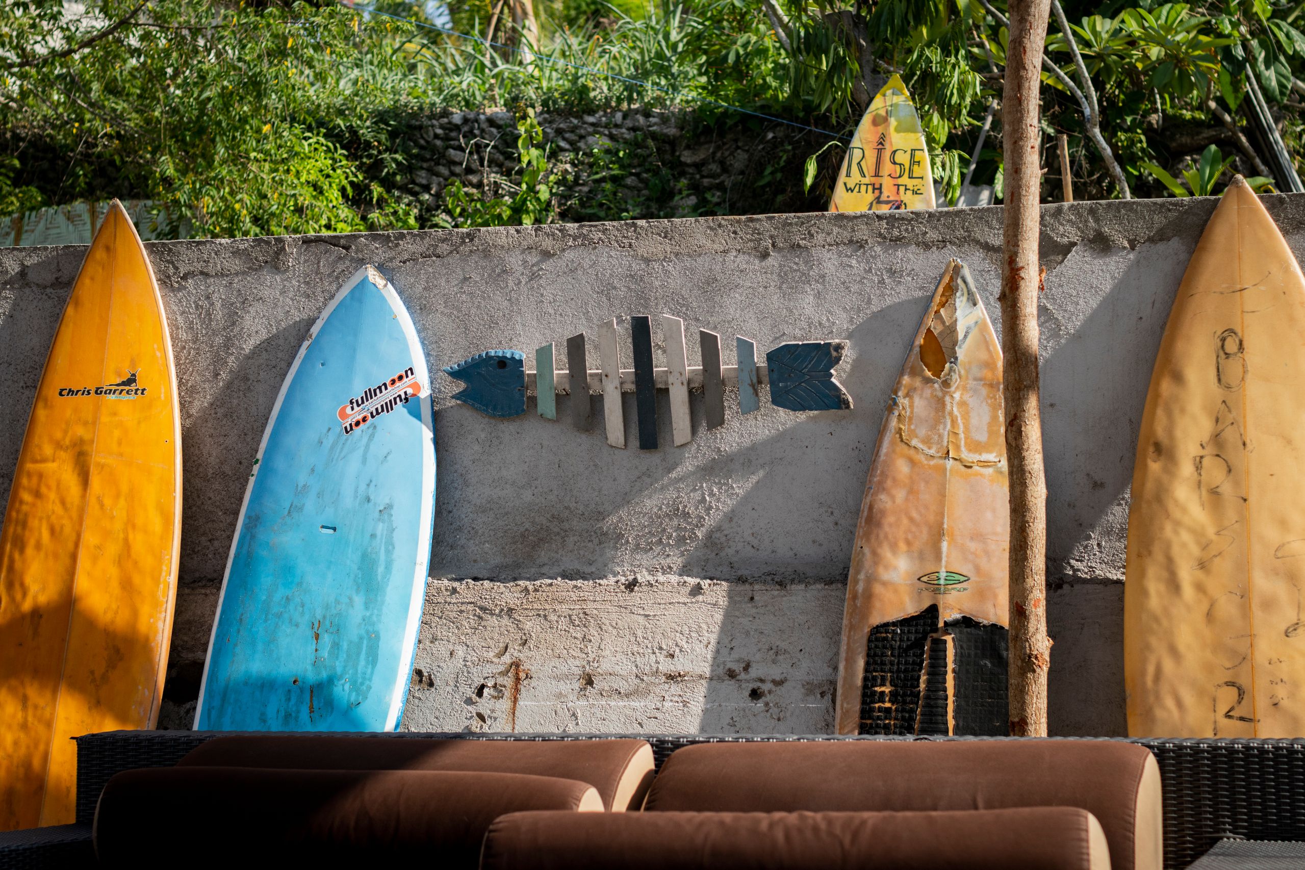 Five surfboards in the sand