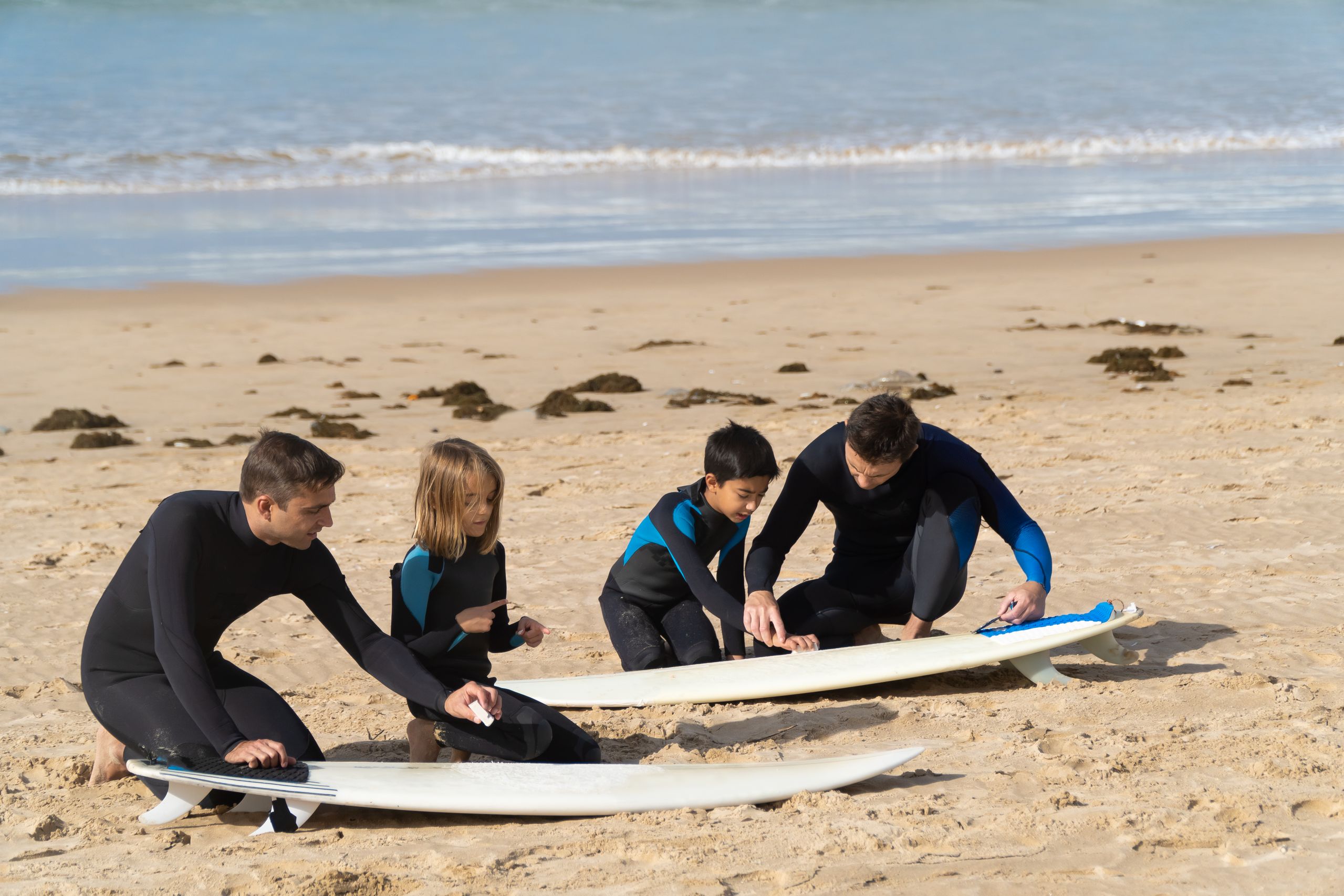 Kids with surfboards on the beach